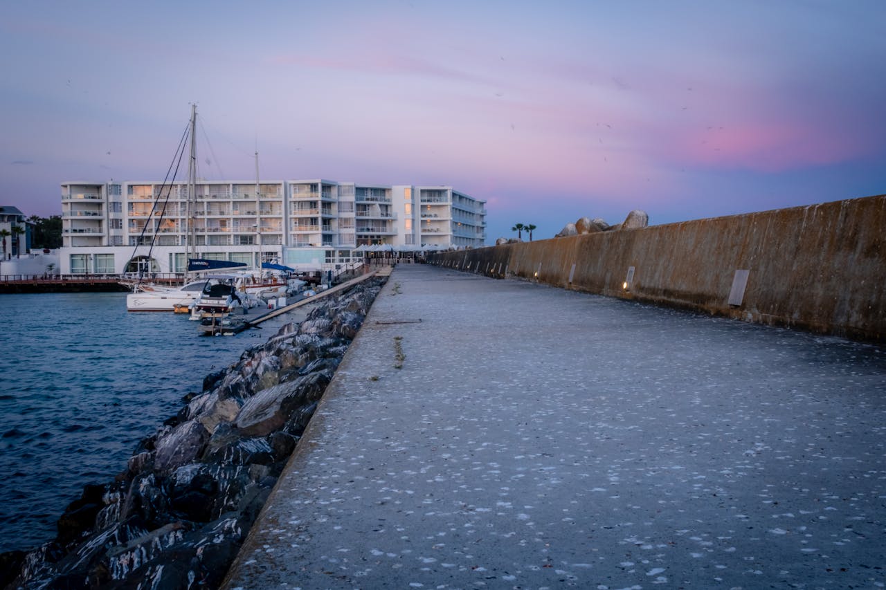 process-img Stunning view of a marina in Cape Town at twilight with pastel skies and calm water.